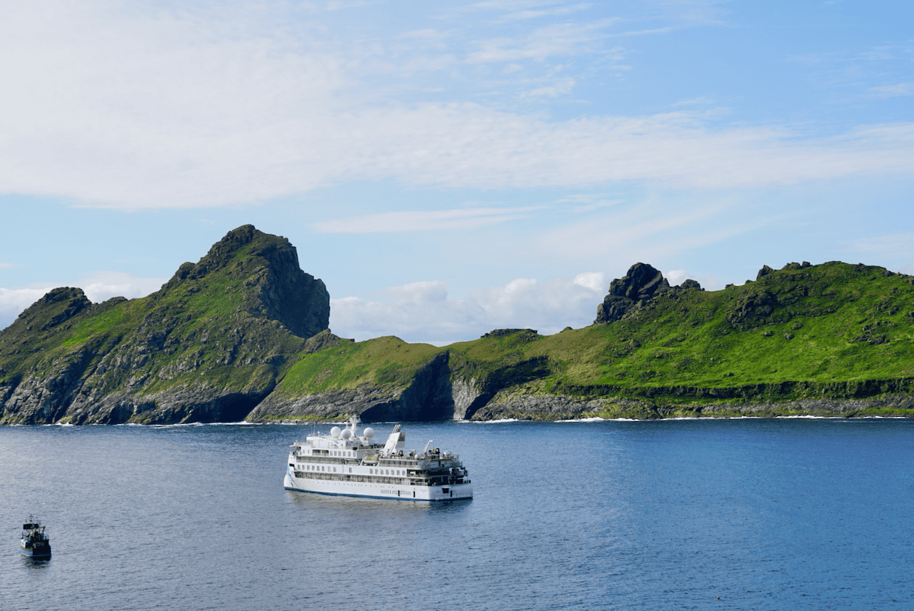 Aurora Expedition ship, the Greg Mortimer, anchored at St. Kilda, Scotland