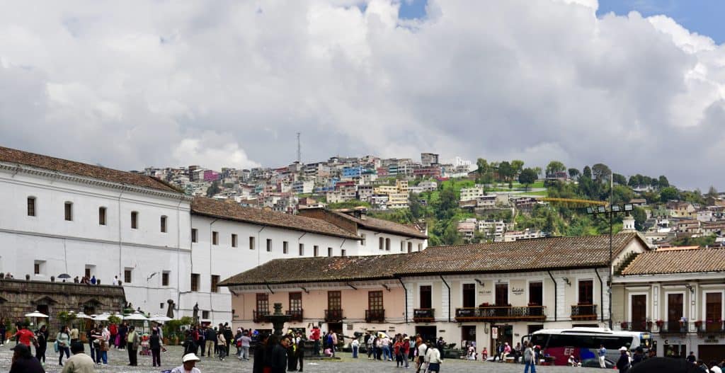 View of building in old town with a hill in the back ground in Quito Ecuador
