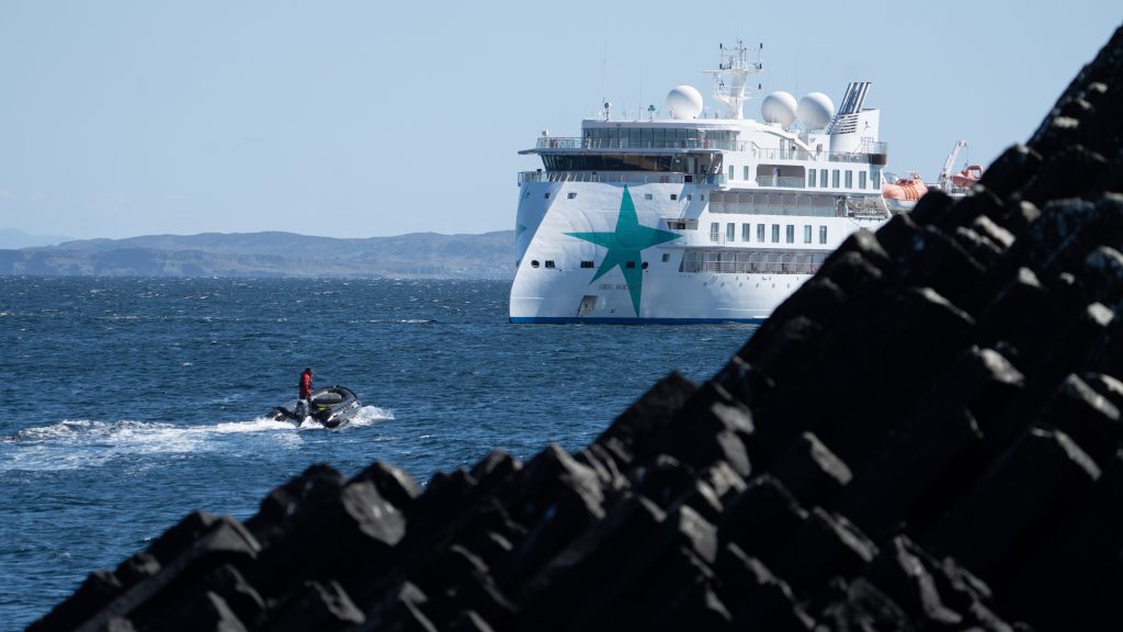 Aurora Expedition cruise ship with zodiac returning