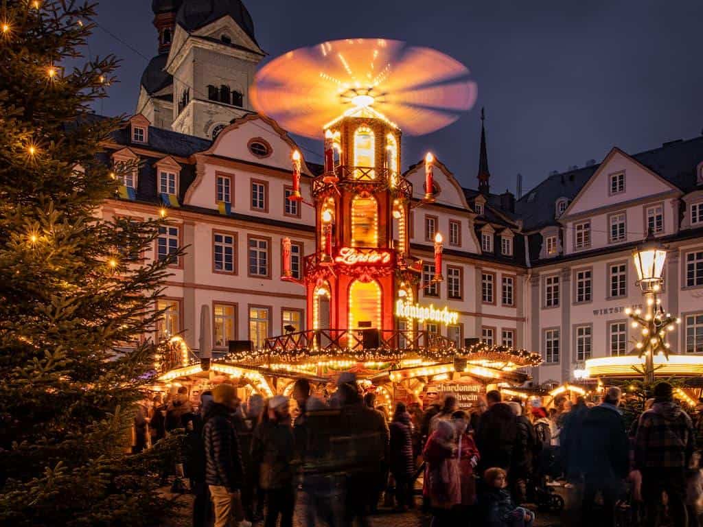 Christmas pyramid glowing above the market on Am Plan square in Koblenz, Germany