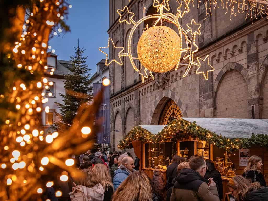 Christmas market stalls and lights in front of the Liebfrauenkirche church