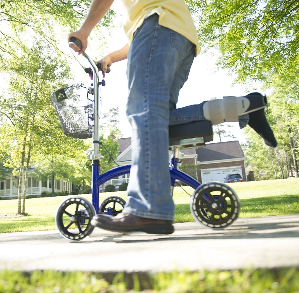 Using a knee scooter on a sidewalk